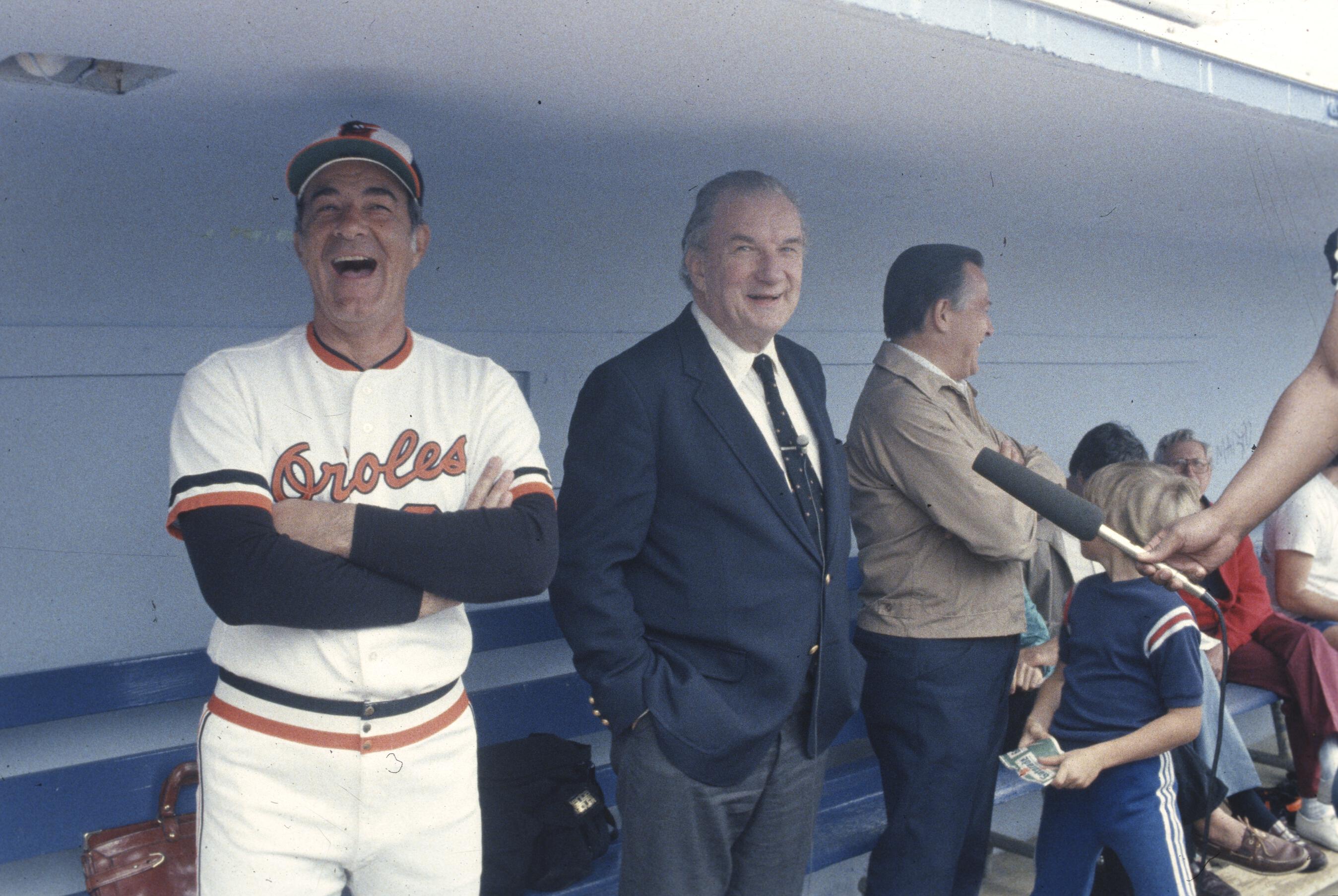 Williams Edward Bennett in dugout with players and coaches