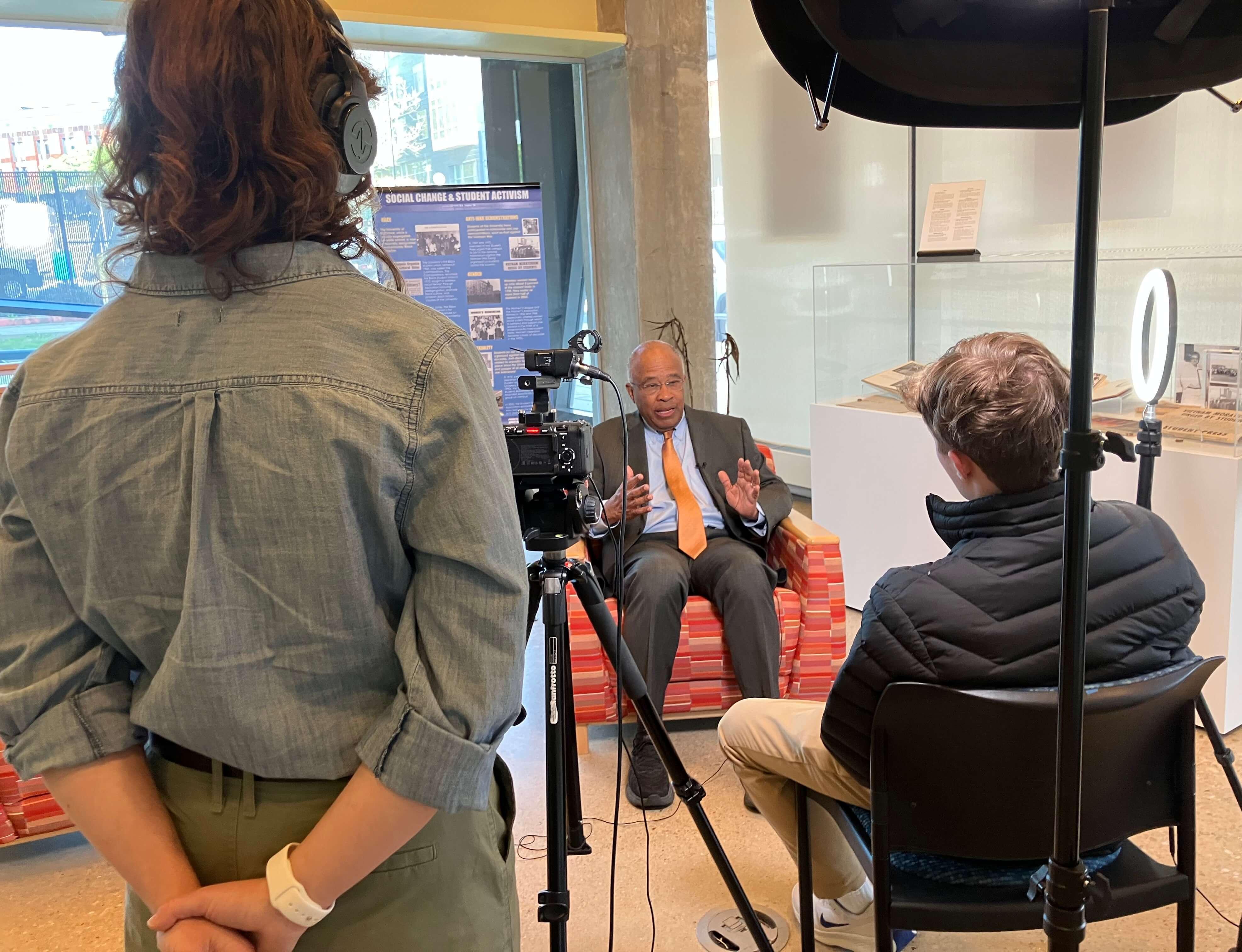 Behind the scenes photo of students interviewing Kurt L. Schmoke, former Baltimore mayor
