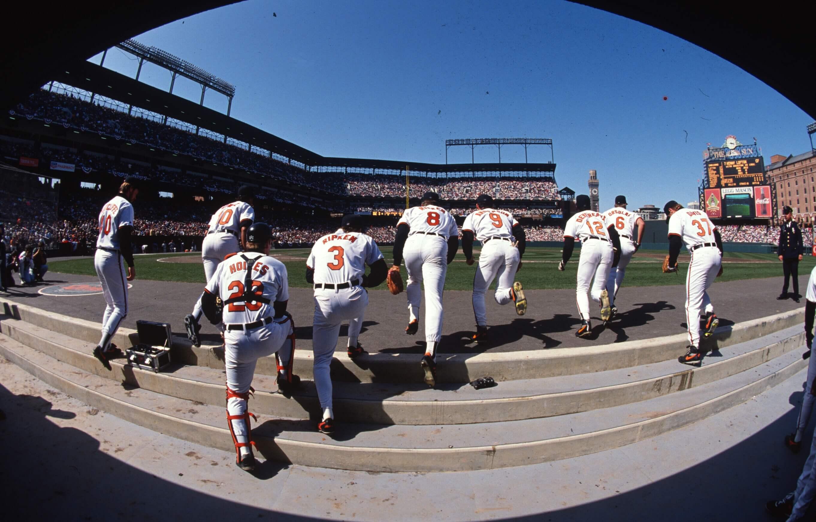 Orioles players run onto the field at Camden Yards